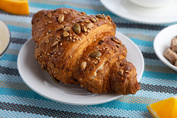 Fresh croissant with seeds ready for breakfast