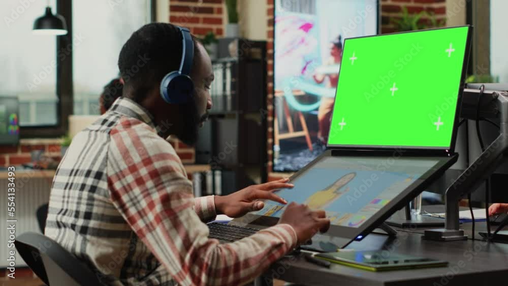 Aufkleber african american editor using greenscreen template on monitor, retouching photos with editing softwa