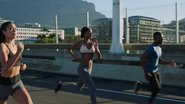 Cape Town, city and friends running for fitness exercise, summer runner workout and cardiovascular health together. Healthy people, training for marathon or sports wellness race in town or commitment - Powered by Adobe