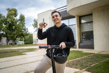 caucasian man drive or ride electric kick scooter e-scooter