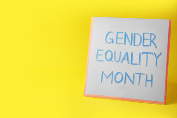 Card with phrase Gender Equality Month on yellow background, space for text