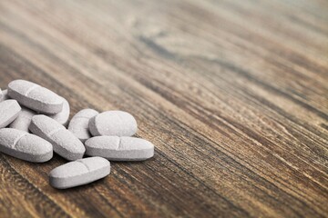 Fototapeta na wymiar Supplements, pills, drugs on dark background.