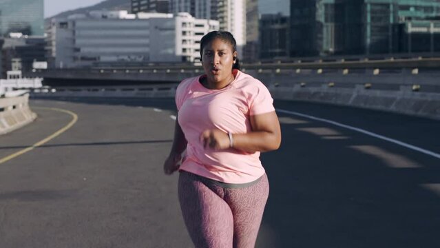 Black woman in city, running and exercise for wellness, health and training. African American female, athlete and runner practice, workout and healthy living for weight loss, cardio or energy outdoor