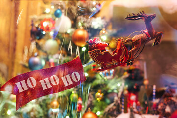 The figure of Santa Claus is on a sleigh with the inscription ho-ho-ho. the concept of Christmas and New Year