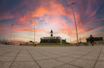 Landscape view of monument Farol da Barra Lighthouse in Salvador, Bahia, Brazil. Beatiful sky sunset summer