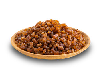 High angle view of dry sweet crystal caramel in wooden plate isolated on white background with clipping path.