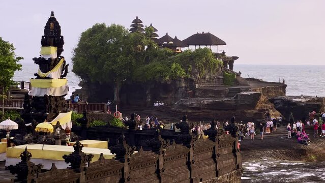 Tourists At The Famous Pura Tanah Lot (Tanah Lot Temple) In Unique Offshore Setting In The Island Of Bali In Indonesia. static