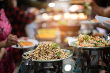 scooping the food, catering, dinner time