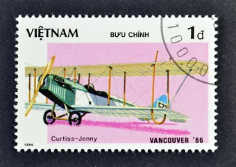 Foto op Canvas Cancelled postage stamp printed by Vietnam, that shows Curtiss JN-4 Jenny,  “EXPO'86” World fair Vancouver (Historic Aircraft), circa 1986. © ilapinto
