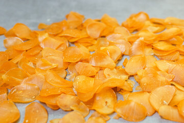 Raw yellow crackers ready to be cooked on a concrete background