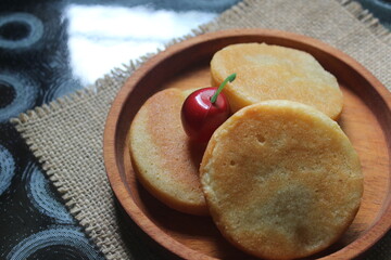 Wingko is a kind of cake made from young coconut, glutinous rice flour and sugar.  Wingko is very famous on the north coast of the island of Java.