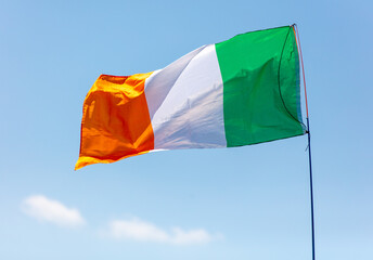 Flag of Ireland against the sky