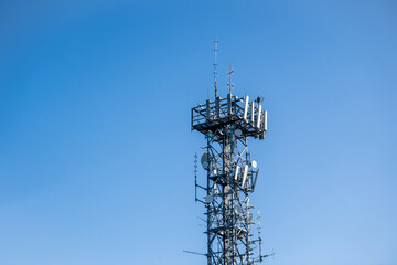 Radio, communication and cell tower on blue sky background. Australia