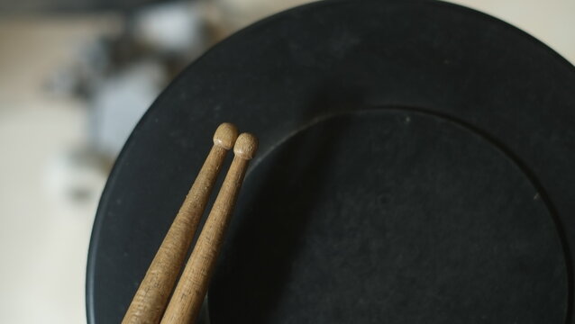 Drum practice pad and drum sticks