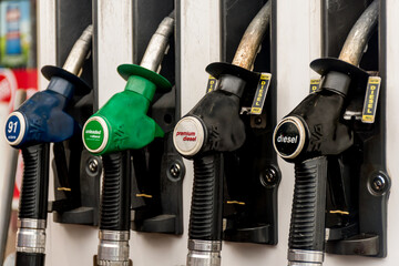 Petrol pumps hoses on a petrol station in Australia - 91, E10 unleaded, premium diesel, ,diesel. Fuel nozzles oil dispensers. Petrol diesel prices concept