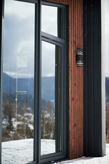 Barnhouse. Close up view of wooden small house in Scandinavian modern style with large window.