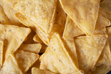 Spicy corn chips nacho close-up, macro shooting. Mexican cuisine.