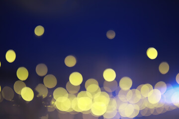 Abstract bokeh background. Golden bokeh circles on dark blue background. Layer overlay.