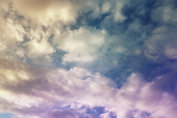 Beautiful sunset sky above clouds with dramatic light. Cabin view from airplane