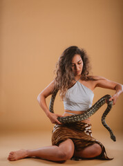 Girl  holding a big  snake