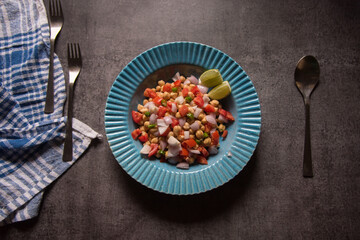 Top view of chickpea salad in a bowl. Selective focus.