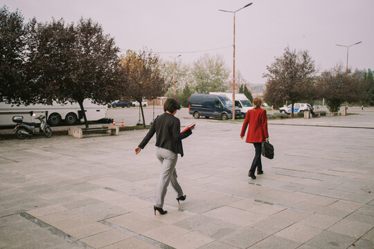 Two business women walking