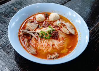 Pork meatball noodles, Tom Yum pork, spicy Thai food.