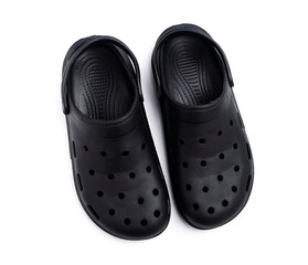 Black rubber sandals with holes all around on a white background.