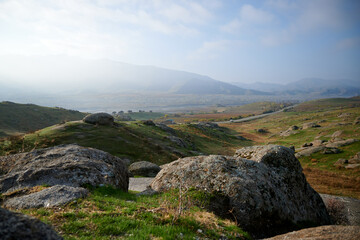 Stones on the background of road and mountains