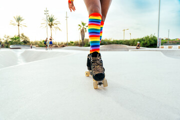 Beautiful woman skating with roller skates and having fun.