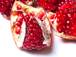 close up peeled pomegranate ripe juicy red berries