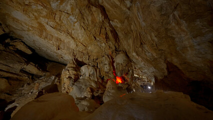 A large stone cave. Action.A gray dungeon with huge stones inside and a dim light.
