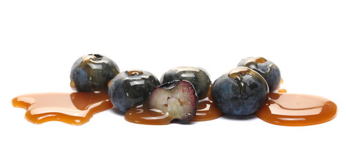 Fresh blueberries topped cream dessert sauce, chocolate flavored dessert isolated on white