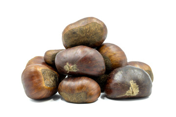 Heap of chestnuts isolated on a white background. Clipping Path. Full depth of field. close up