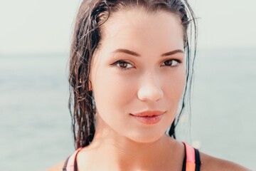 Woman sea sup. Close up portrait of beautiful young caucasian woman with black hair and freckles...