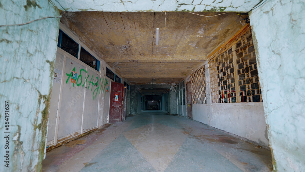 Poster corridor of abandoned building. action. old crumbling building with corridor and flashing lamp. aban