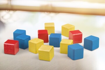 Obraz premium Toy colored wood cubes on desk