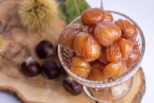 Chestnut dessert and chestnuts on a plate. Traditional delicious Turkish dessert; chestnut candies (Kestane Sekeri)