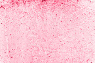 concrete background. texture of old dirty pink concrete stone wall as backdrop. grunge grey cement surface like structure paper material close up. toned in viva magenta, trend color of the year 2023