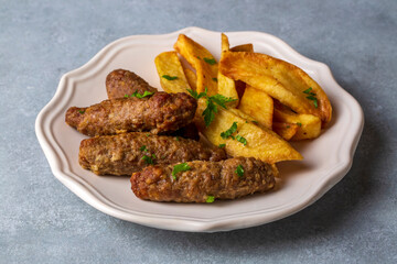 Traditional Turkish food; dry meatballs or inegöl meatballs with potatoes (Turkish name; Kuru kofte or anne koftesi)