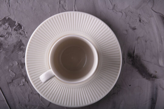 photo empty white cup with saucer top view