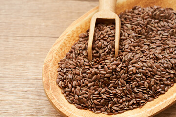 flaxseed linseed in wood bowl on wooden table background. close up flaxseed linseed. flaxseed linseed                                 