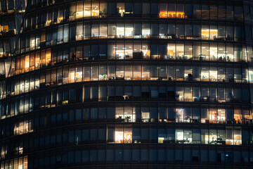 Fototapeta na wymiar windows building front facade by night