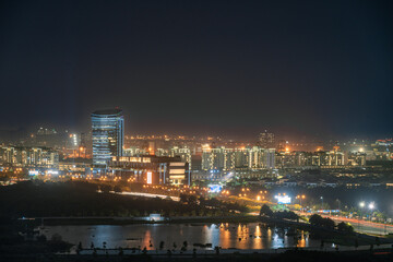 Fototapeta na wymiar HO CHI MINH, VIETNAM - November 11, 2022: Ho Chi Minh City at night, view to District 2, Thu Duc City, light trail, landmark 81