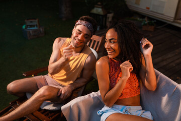 Obraz premium Young couple on vacation with the camper. Concept about wanderlust road trips and lifestyle on vacation