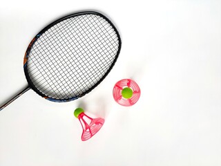 Windproof nylon plastic shuttlecocks with a racket isolated on white background. Top view