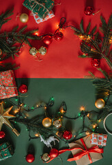 nice colorful Christmas and New Year background with copy space and fir tree branches, festive decorations and wrapped presents