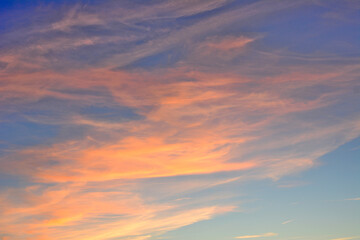 blue sky with red and orange clouds isolated, close-up