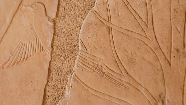 Carved Image Of A Bird On A Tree On A Stone Stele Of An Ancient Temple In Egypt