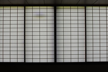 Rectangular and square Japanese shoji paper window frame with partitions with light in Japan - obrazy, fototapety, plakaty